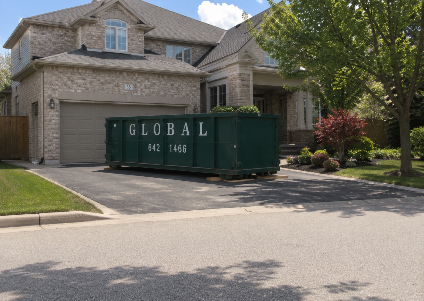 Dumpster rental delivered to a GTA driveway